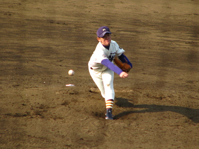 a baseball player that is throwing a ball
