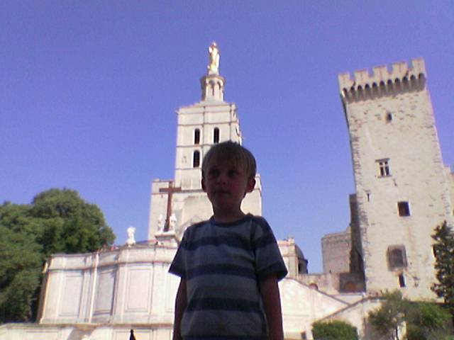  in front of a castle looking at camera
