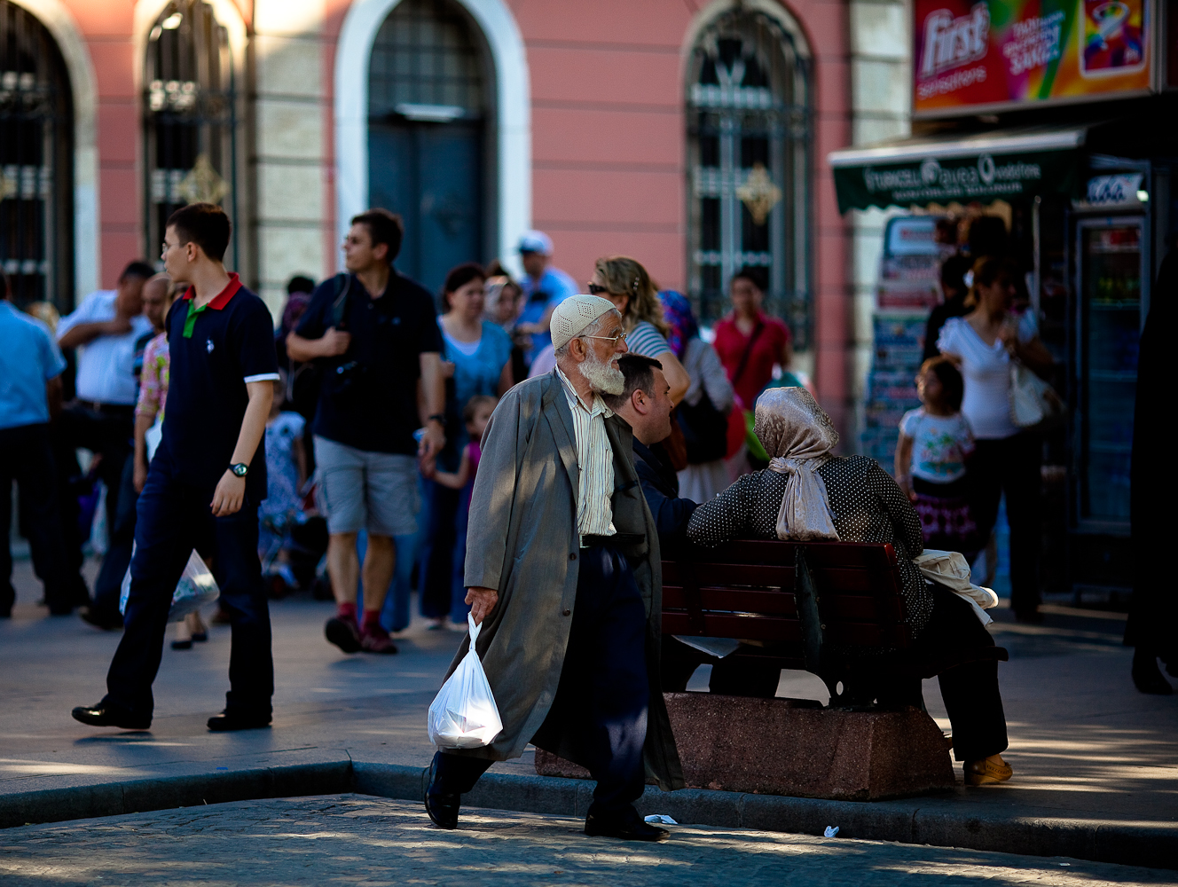 people walking and standing on the side walk