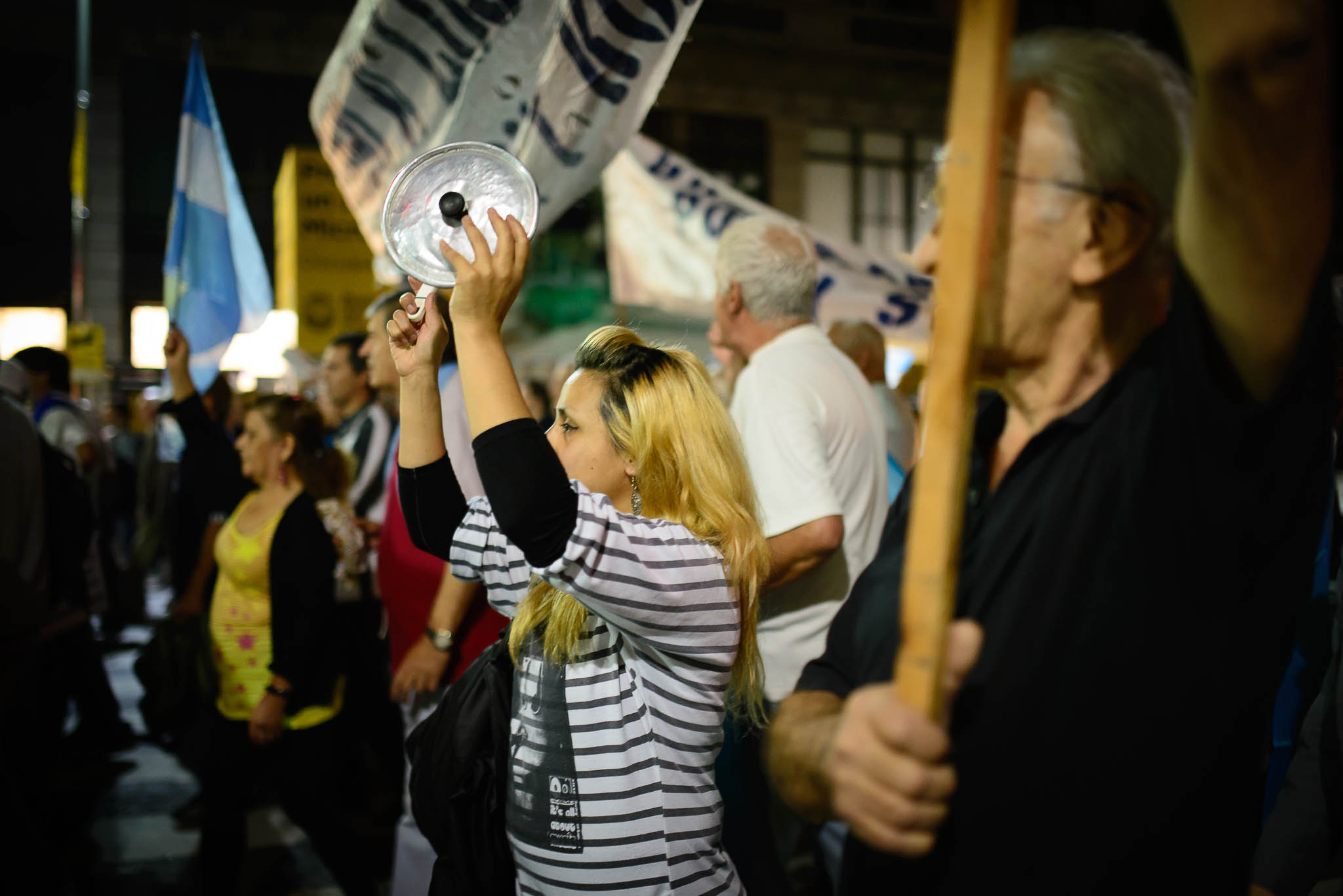 a group of people holding up flags