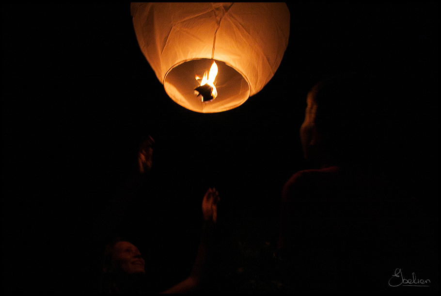 the lantern has flame as well as two women