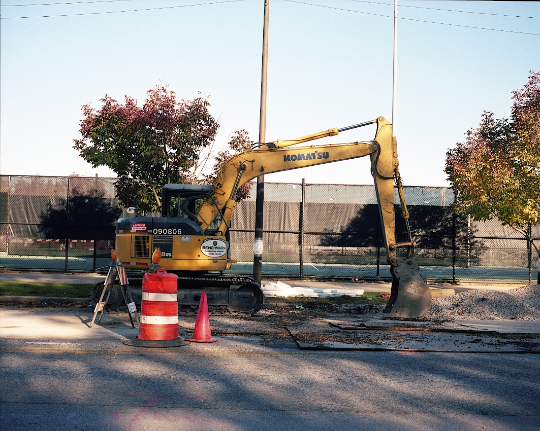 a digger in the middle of a construction site