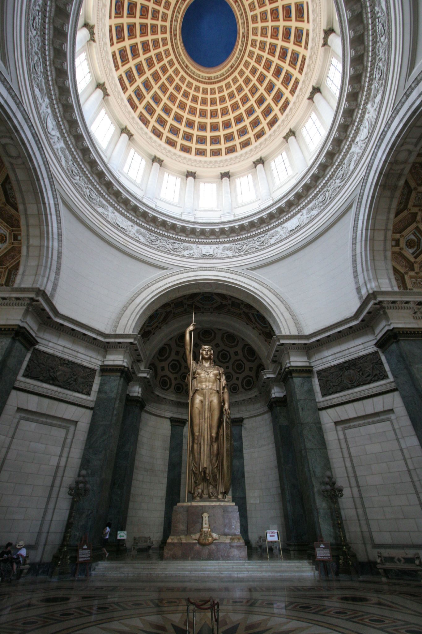 an empty room with some columns on the ceiling