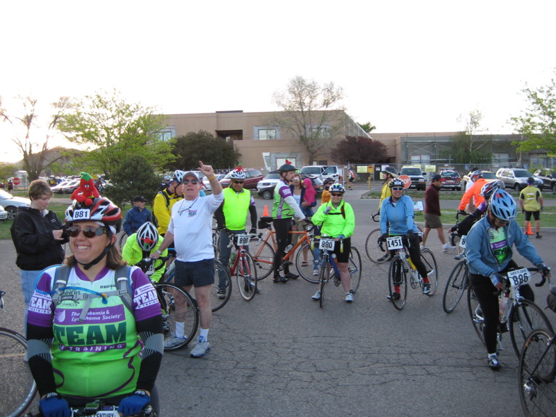 a group of people riding bicycles on top of a street