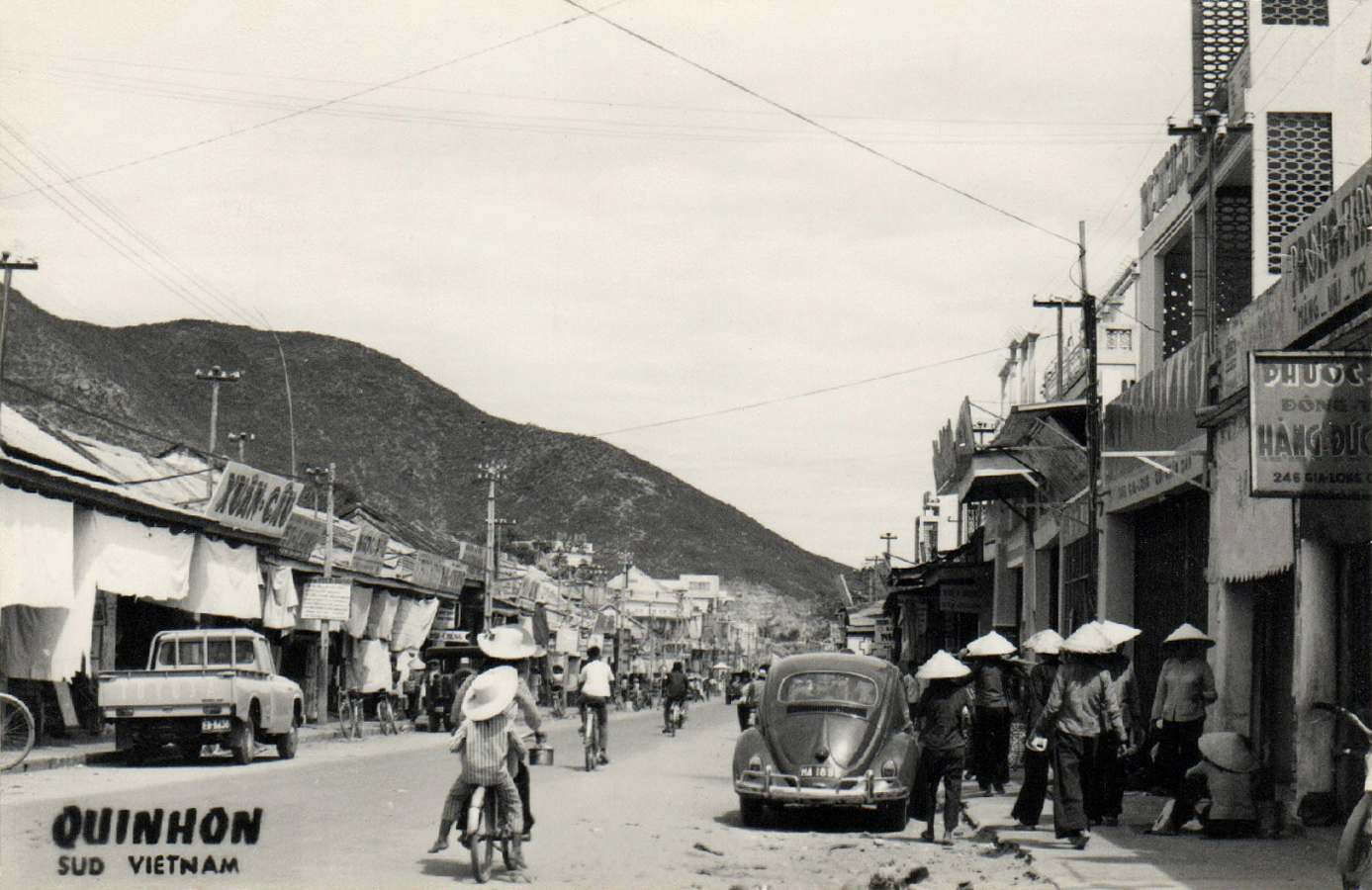 this is a black and white po of some people walking down a street