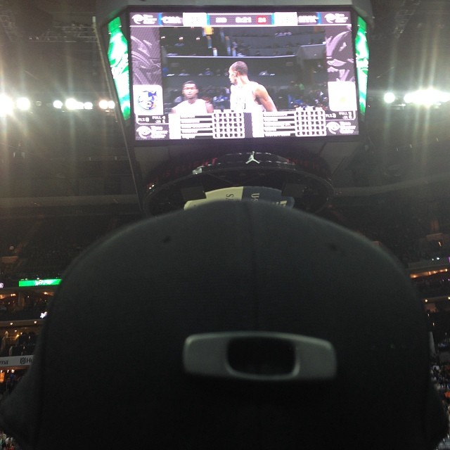 a basketball game in the arena is being watched by a man