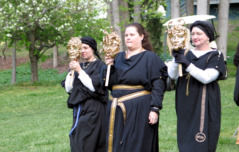 a group of women dressed in renaissance costumes