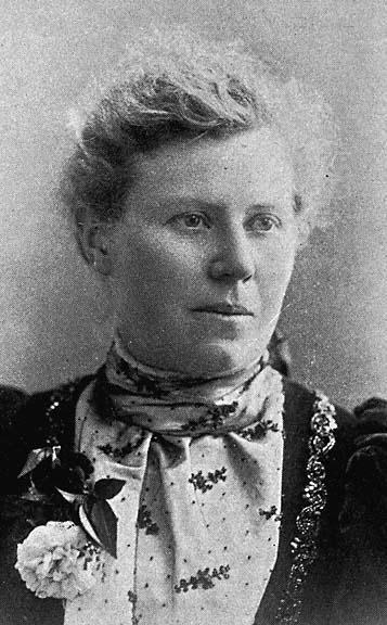 a woman with a flower tied to her neck