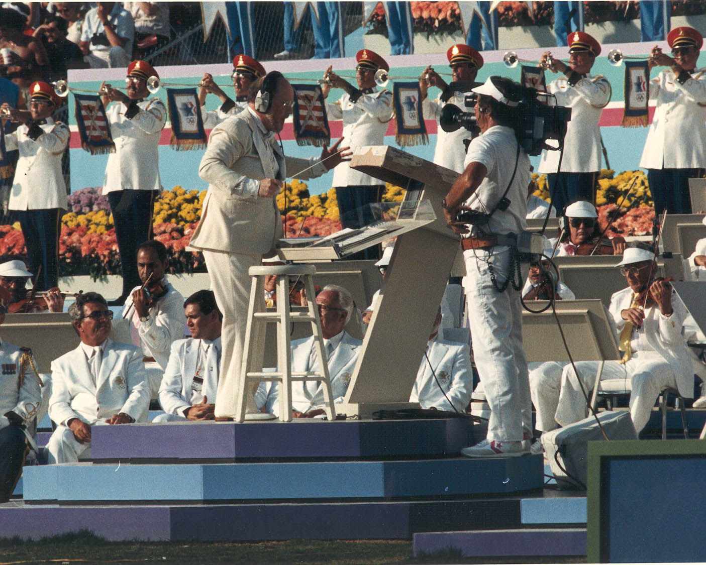 musicians on stage with music instruments and a conductor