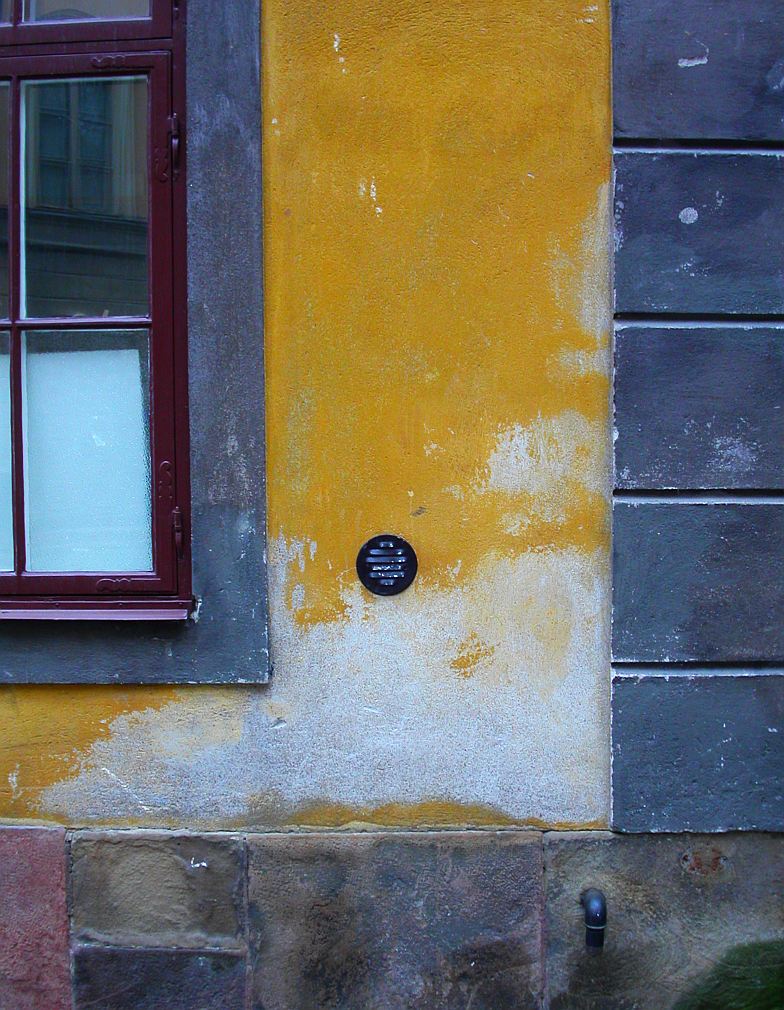 an orange building with the clock on it