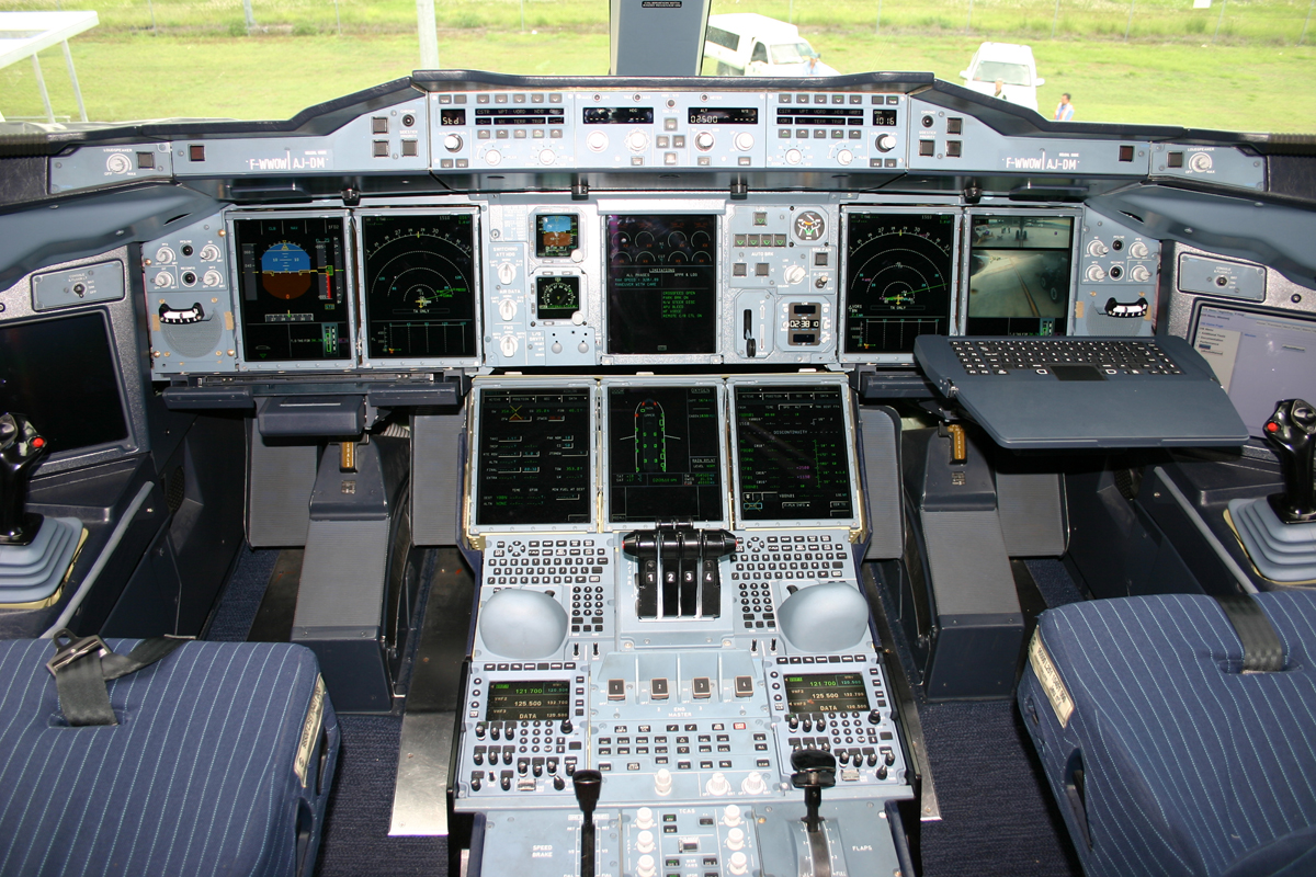 inside the cockpit of a plane, many electronic displays