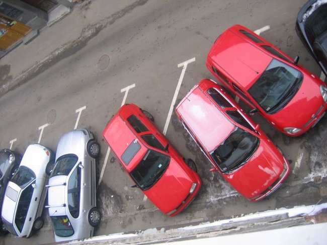 cars parked in parking spot of commercial area