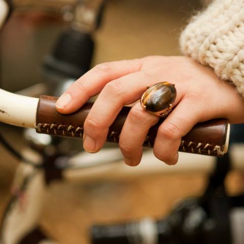 a close up of a person holding a bike handle