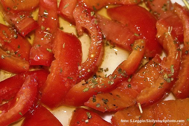 some slices of bread and tomatoes are sliced into quarters