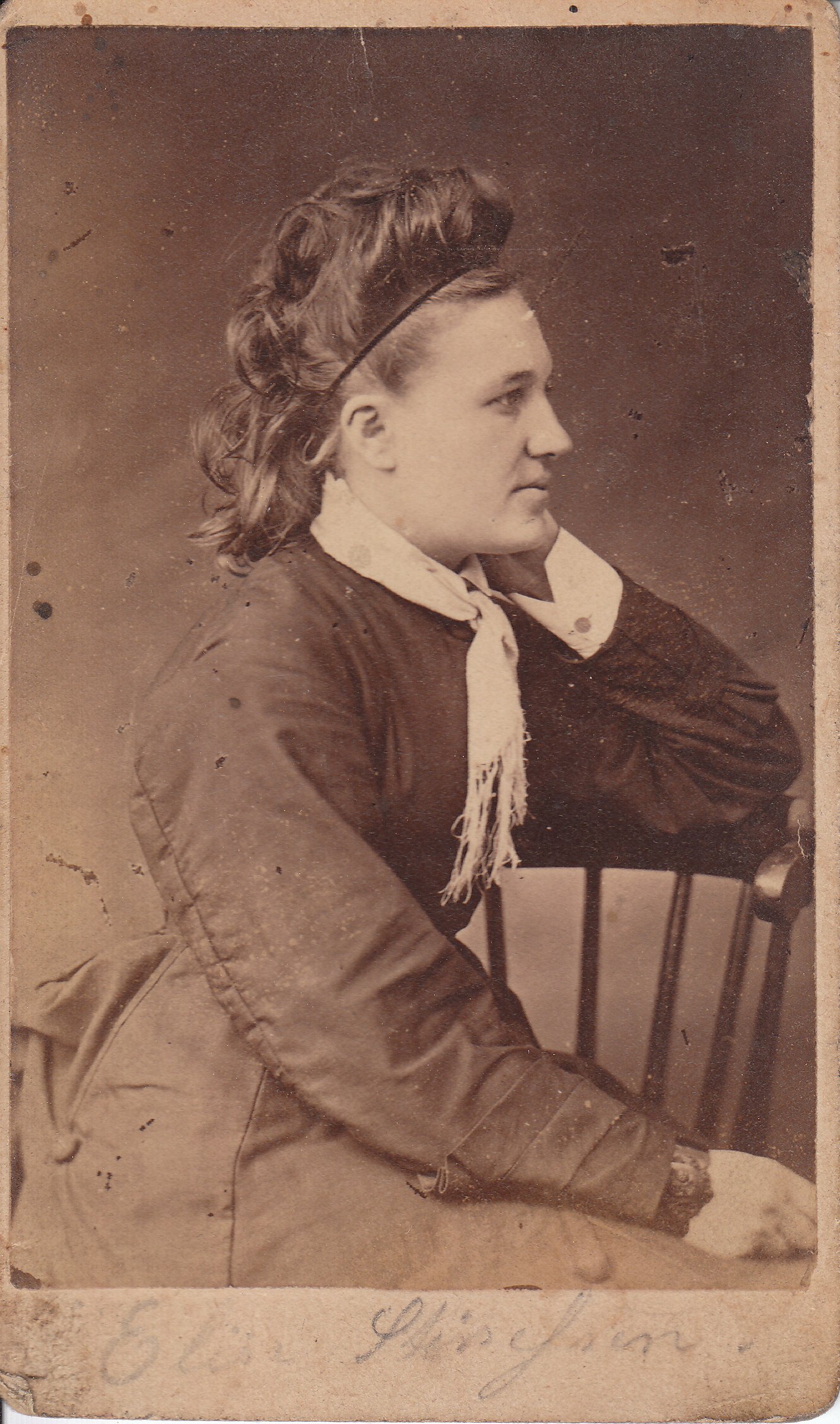 an old po of a young woman wearing a scarf