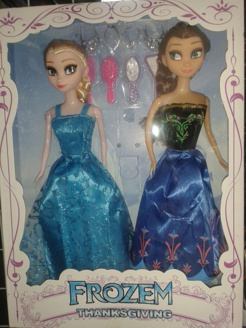 two frozen toys are set in a cardboard box