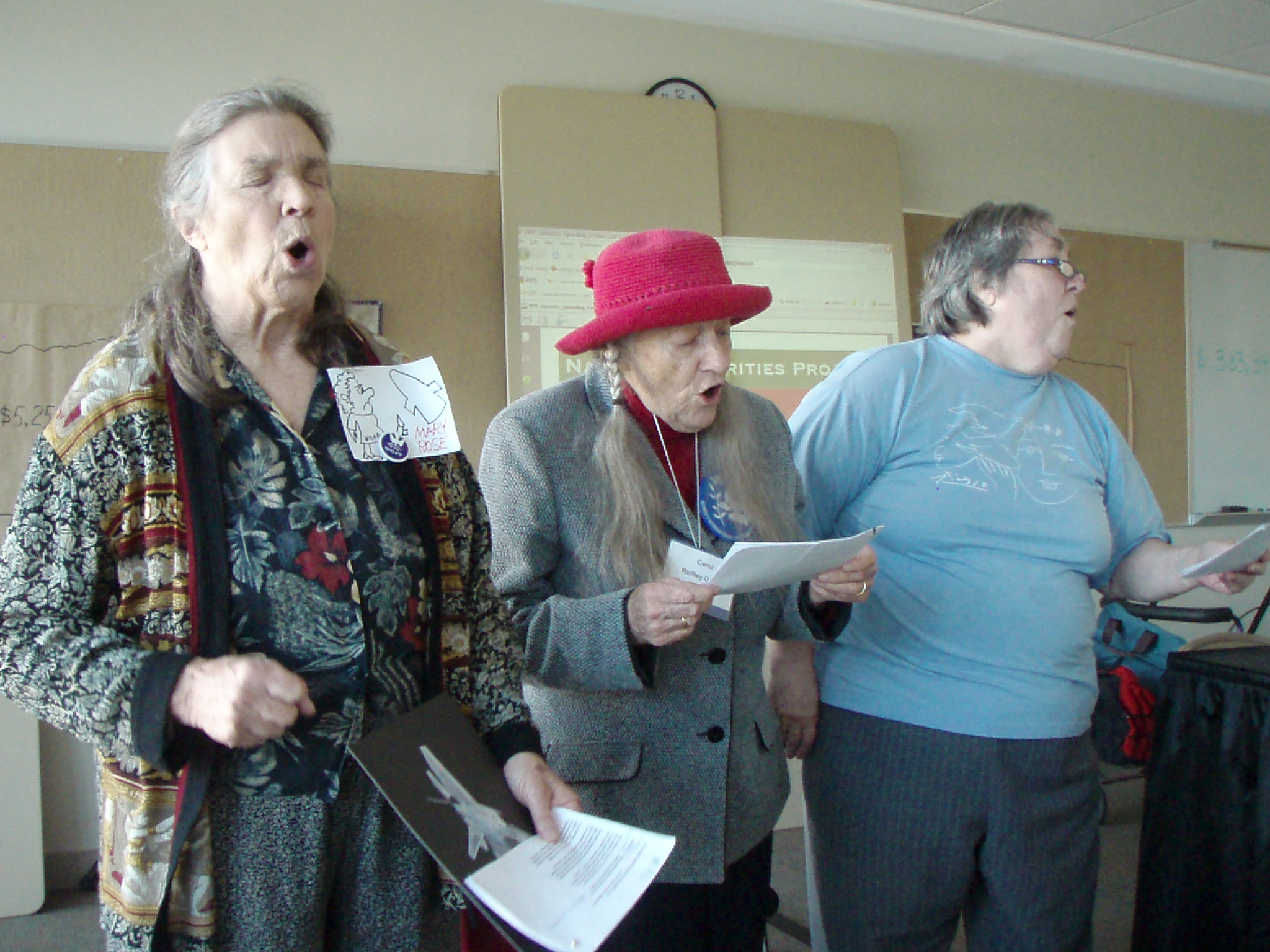 the women have their mouths open as they stand together