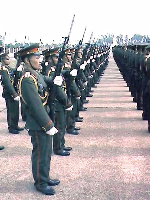 a parade of men and women in uniforms