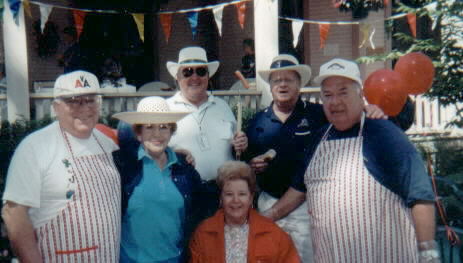 a group of people with aprons, hats and hats