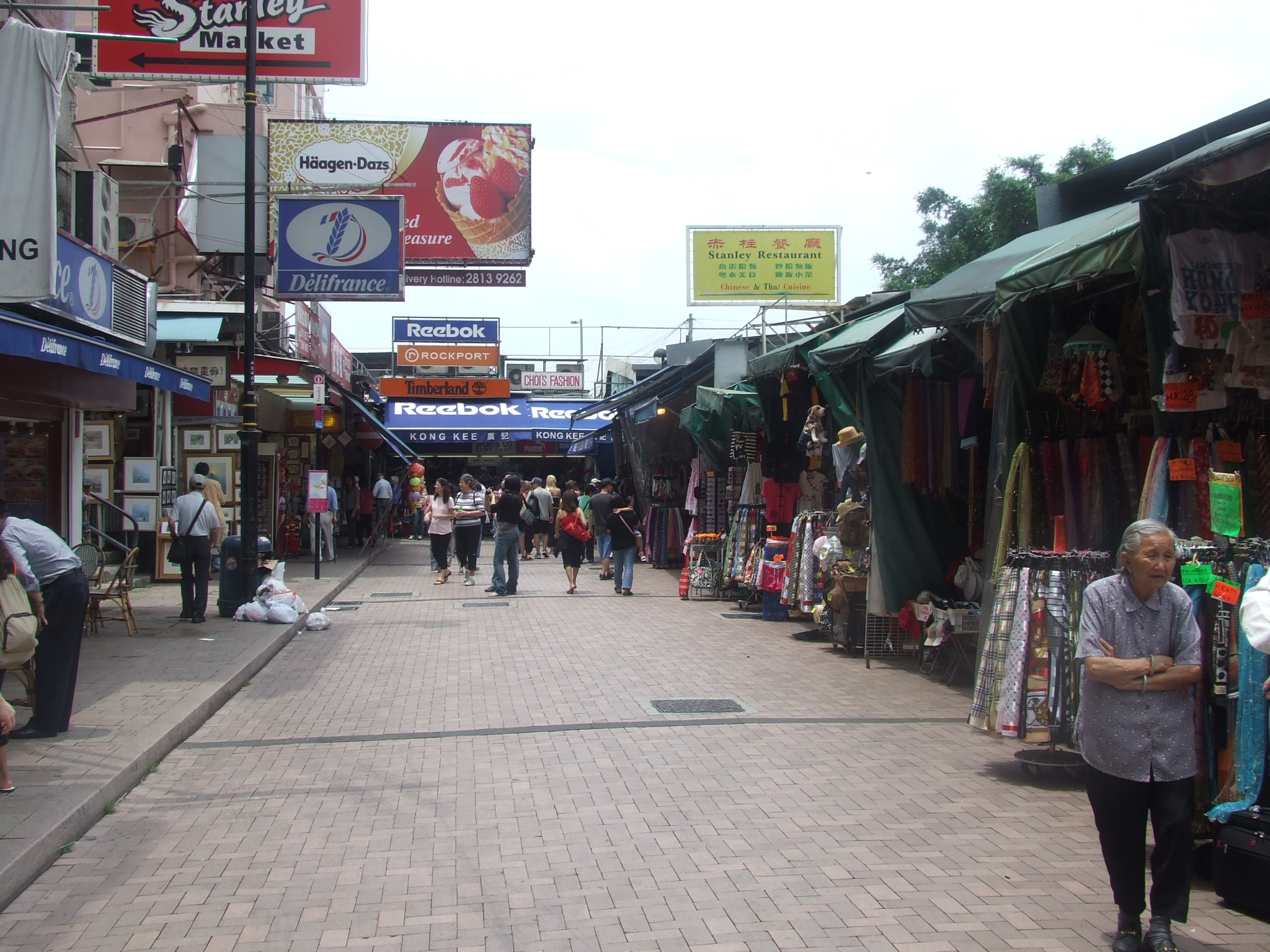 the narrow street in front of the stores is full of shops