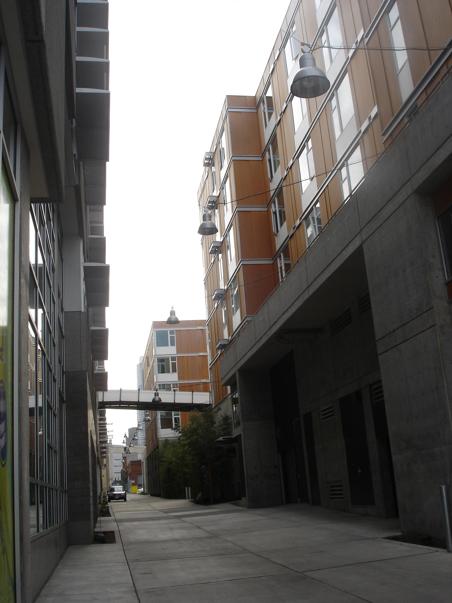 a street with multiple story buildings lining the road