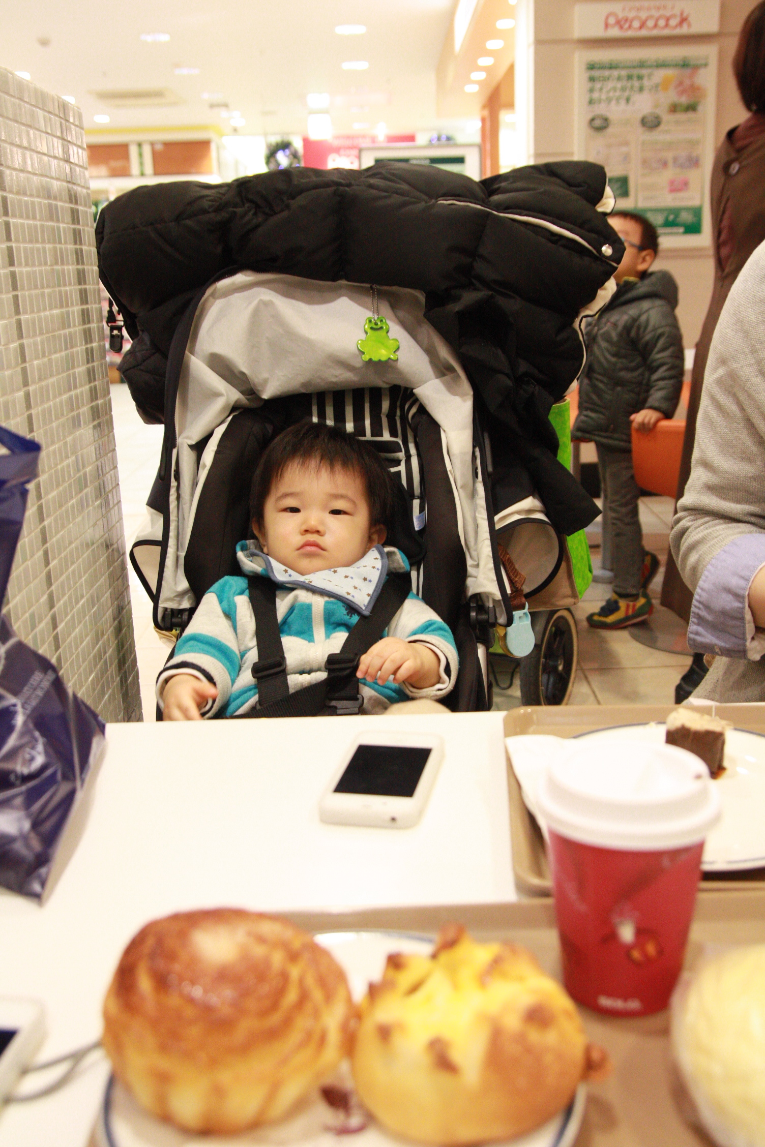 a baby in a stroller that is in a store