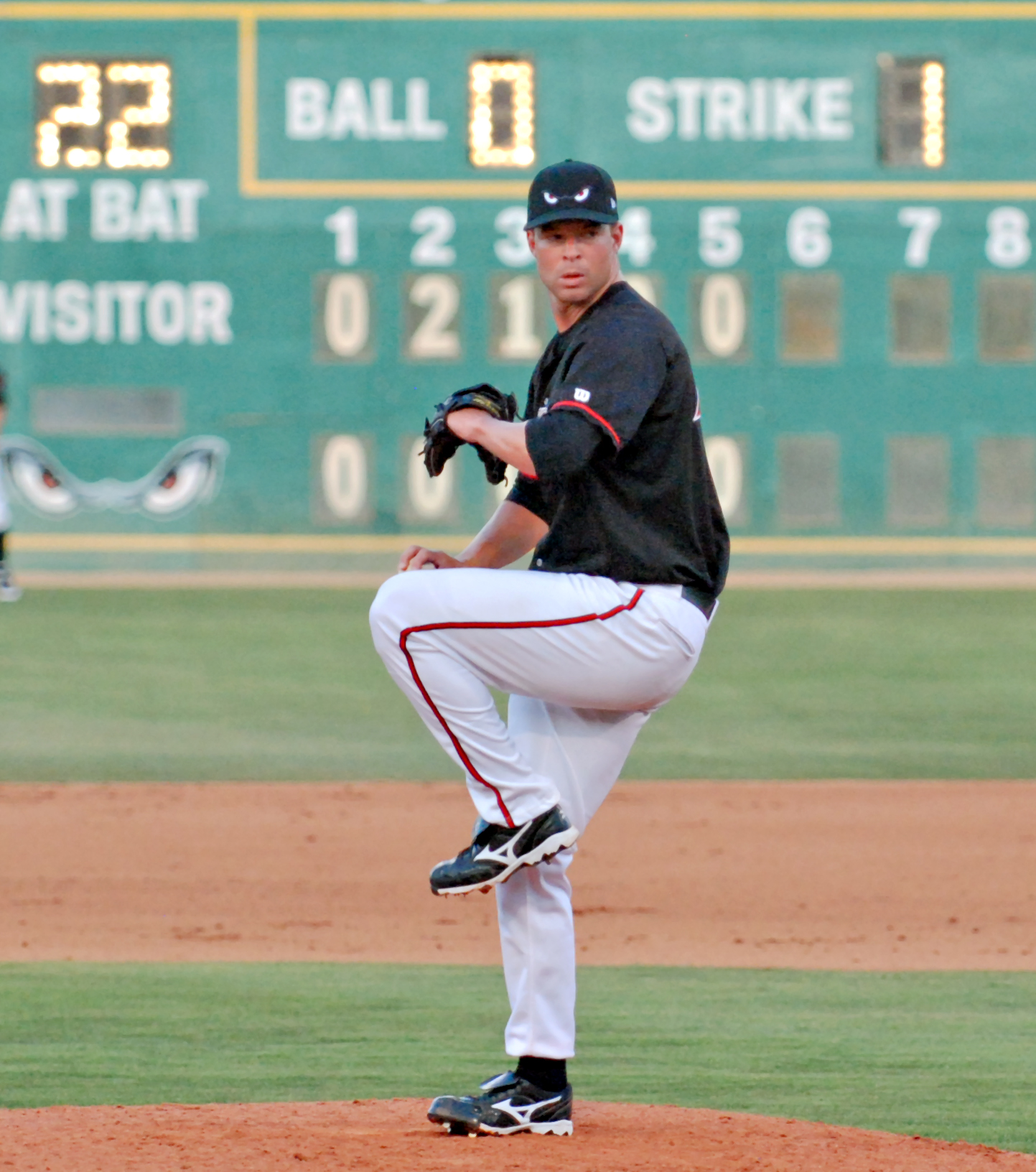 a baseball player pitching a baseball during a game