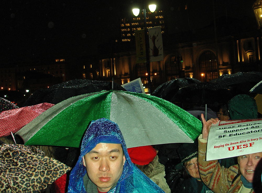 a person with a sign at a rally