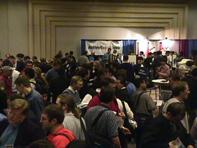 a large group of people standing in a room