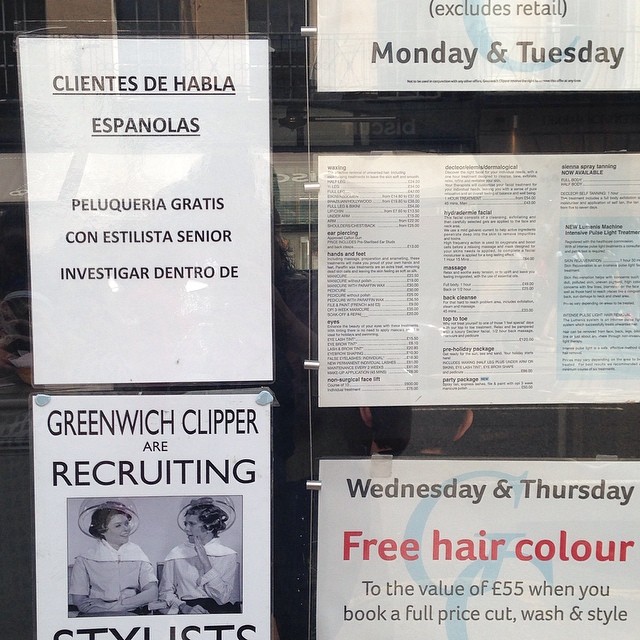 signs advertise hair and beauty salons for women