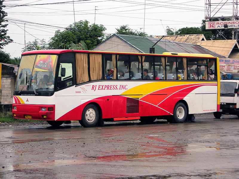 a public transit bus driving on a city street