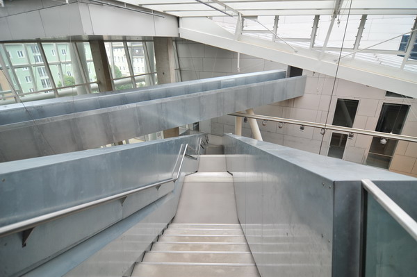 the staircase to the top floor leads up to a second story