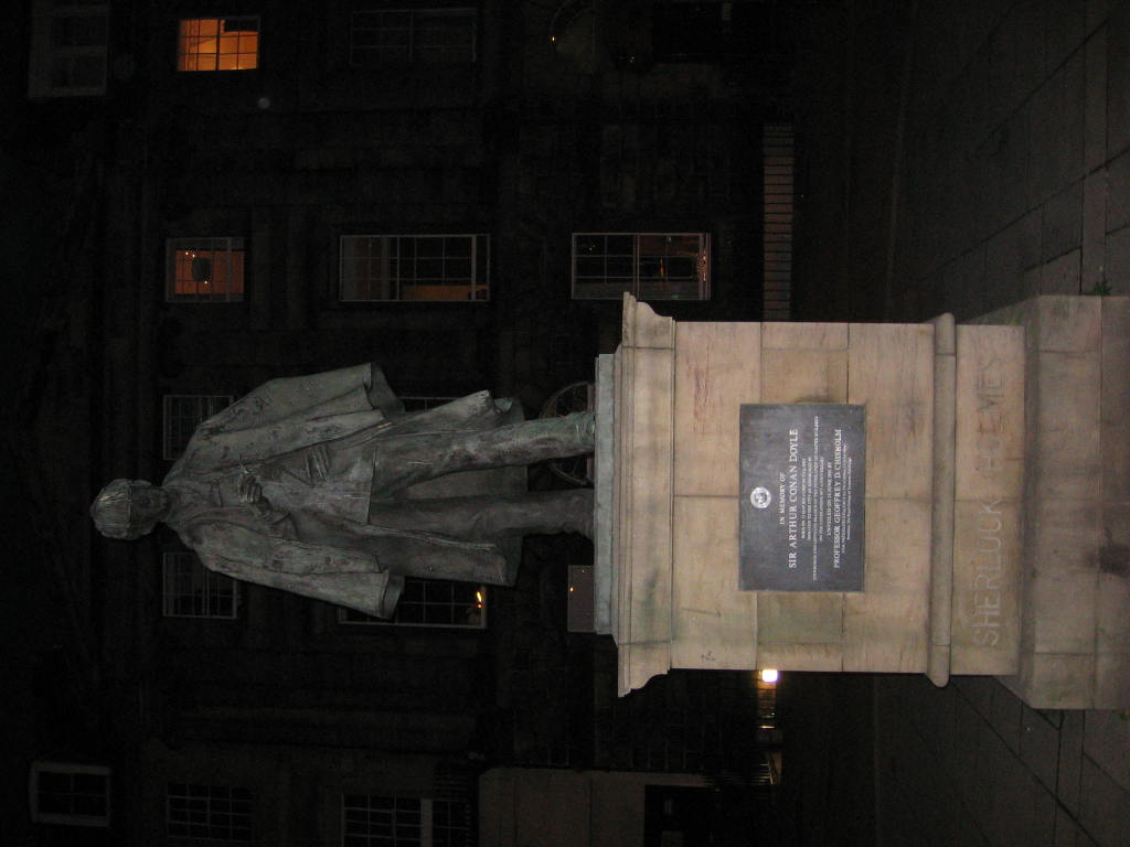 a statue in the middle of a building at night