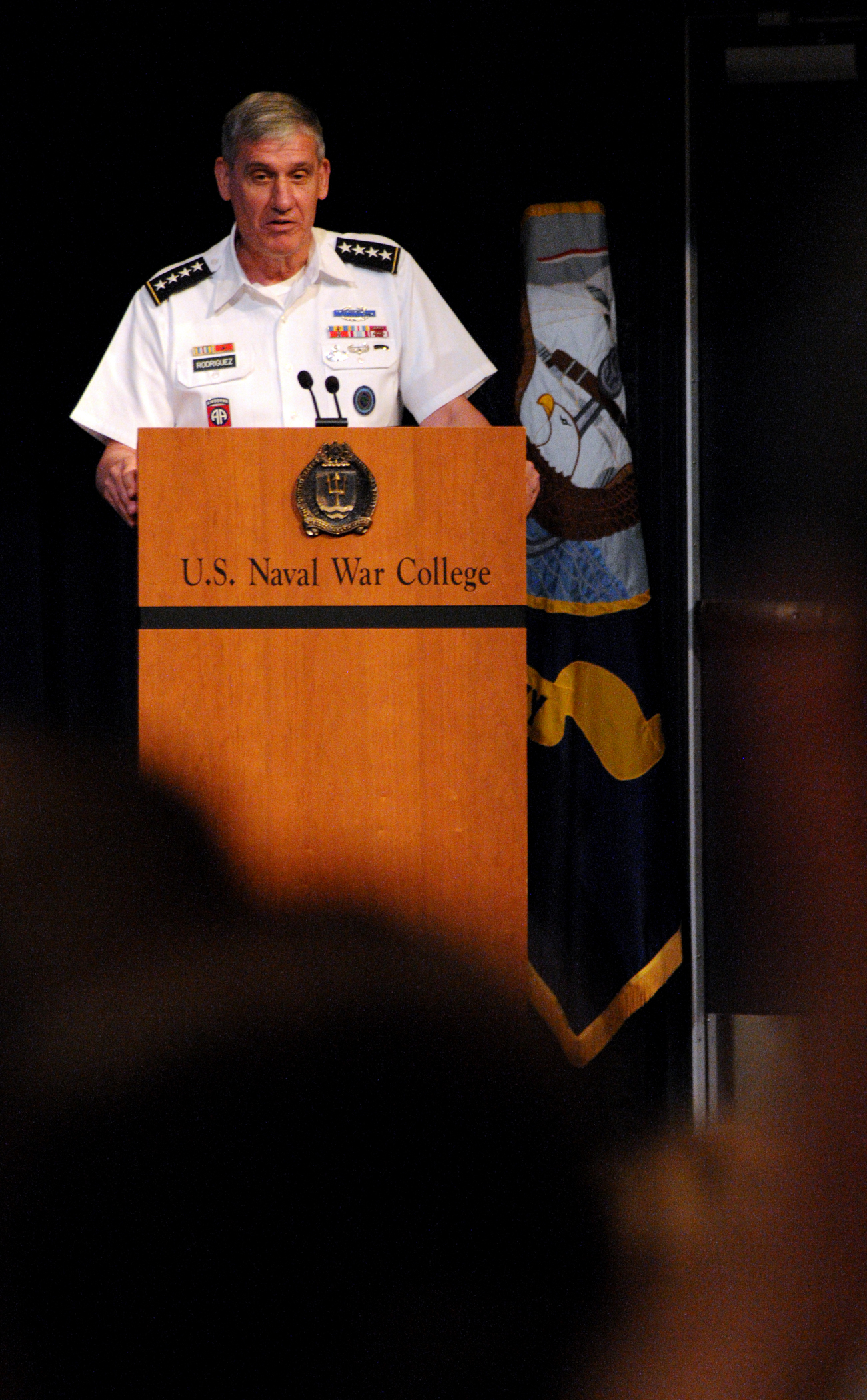 a naval war college official giving a speech