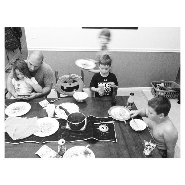 a family enjoying dinner at the table