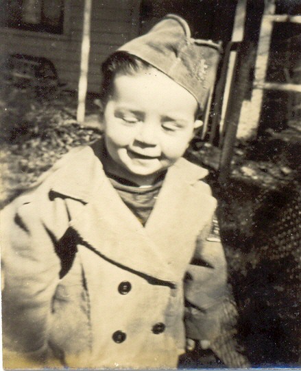an old po of a child wearing a hat