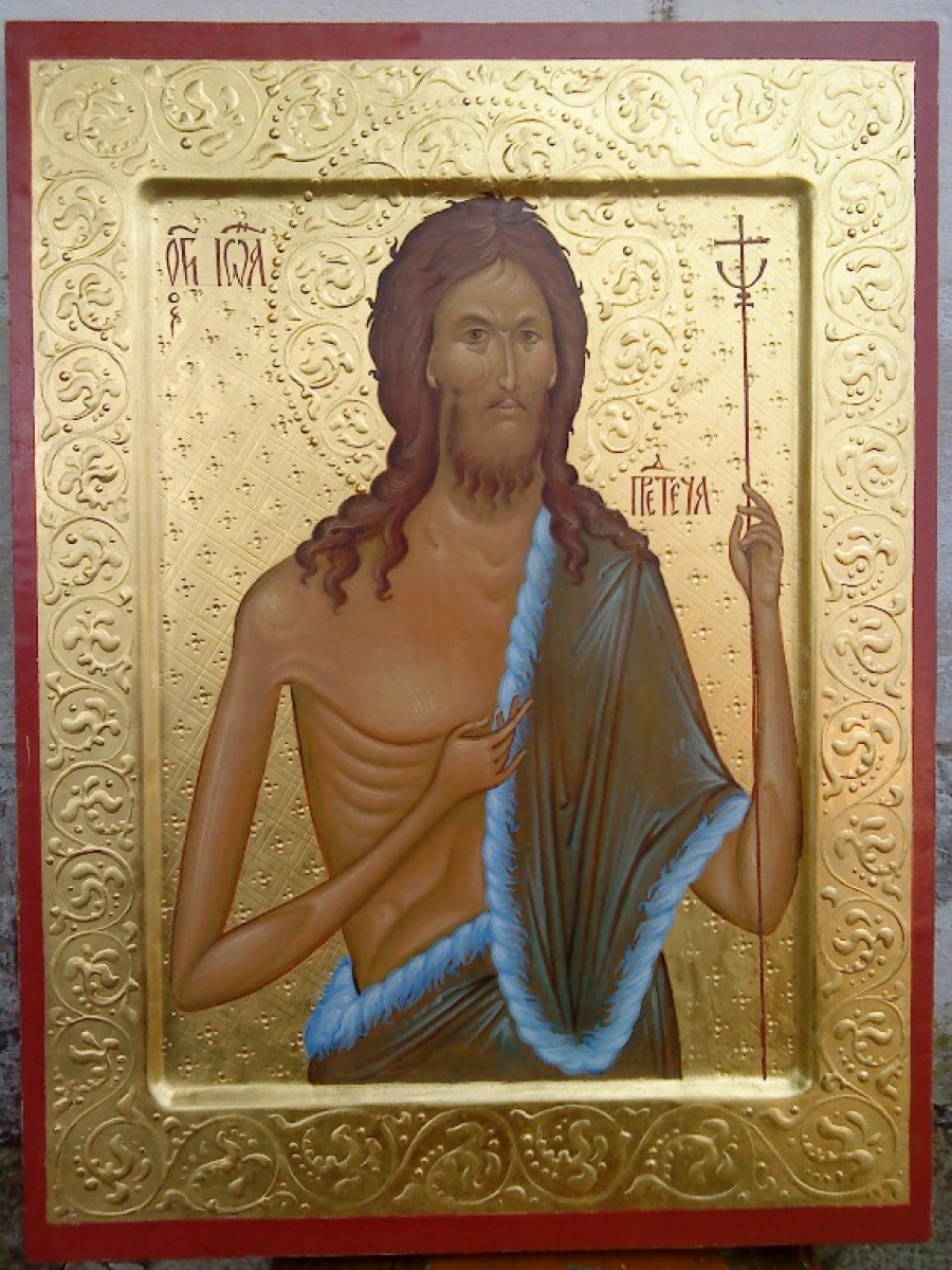 a religious icon of jesus holding a sword