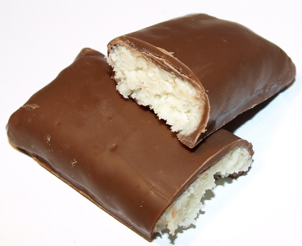 a partially eaten chocolate bar sitting on top of a white table