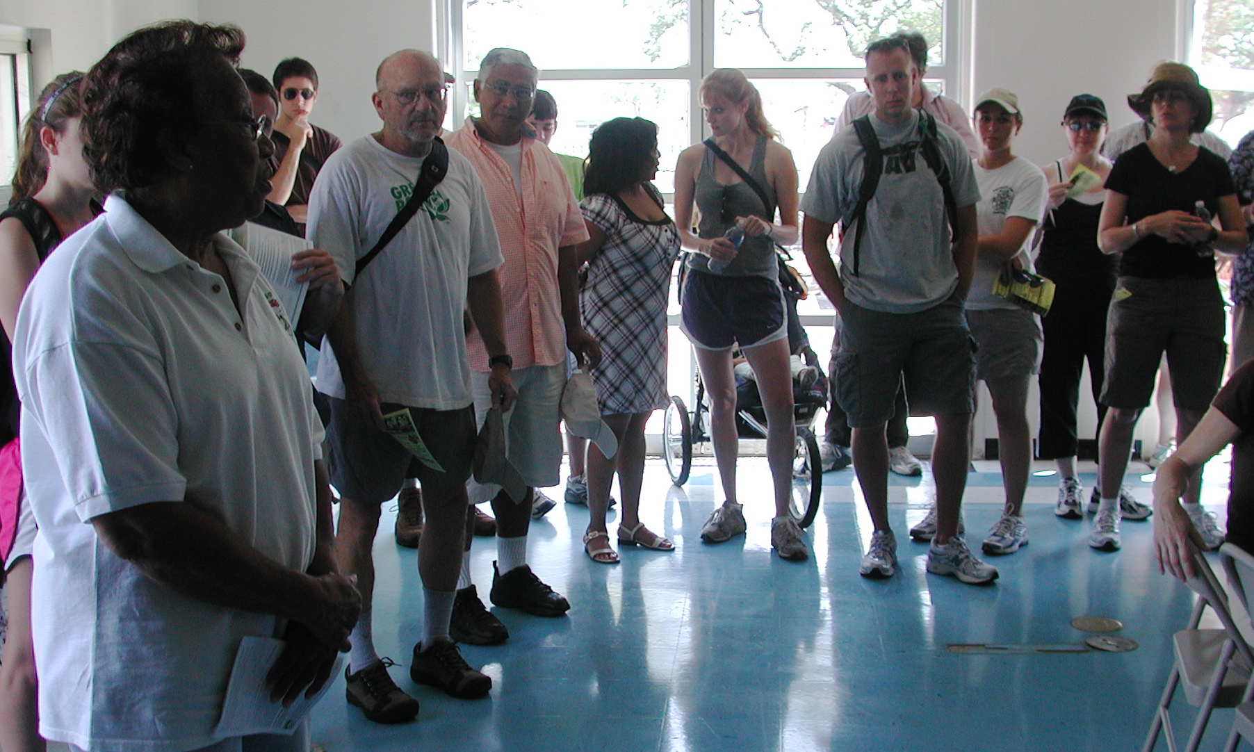 a group of people who are standing in the room