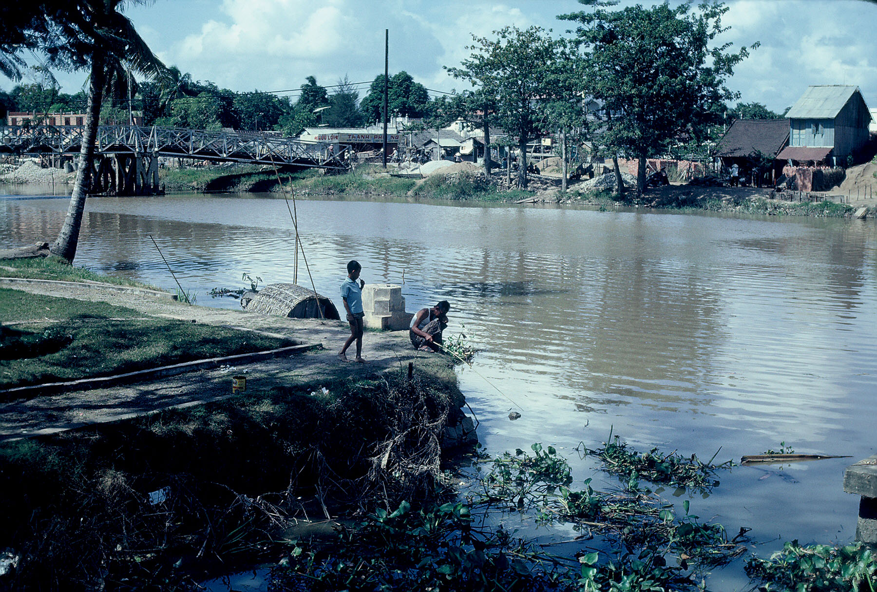 two people who are standing in the water