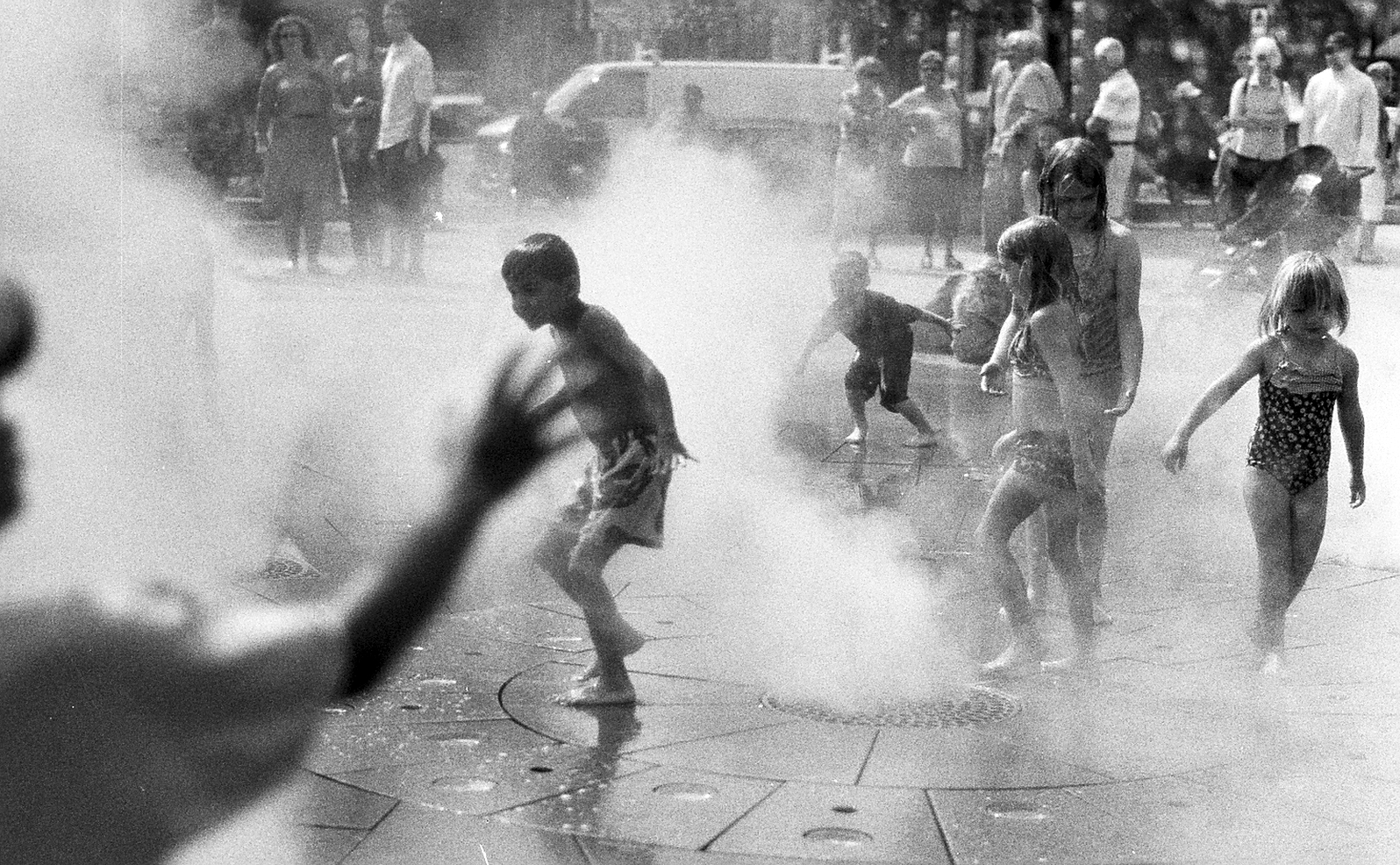 a group of young men playing in a fire extinguisher