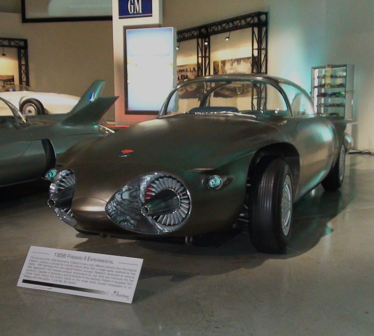 cars and autos on display in a museum