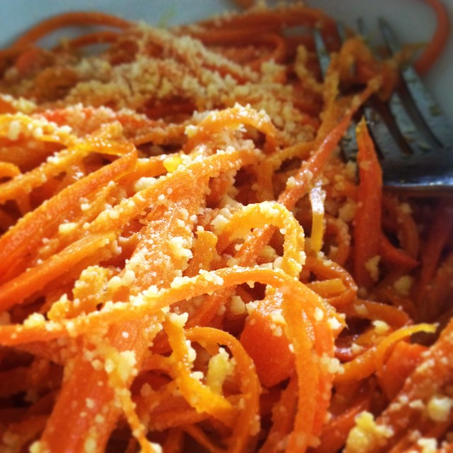 a bowl of chopped up carrots on a table