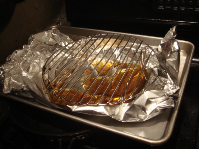an image of a grill cooking  dogs in the oven