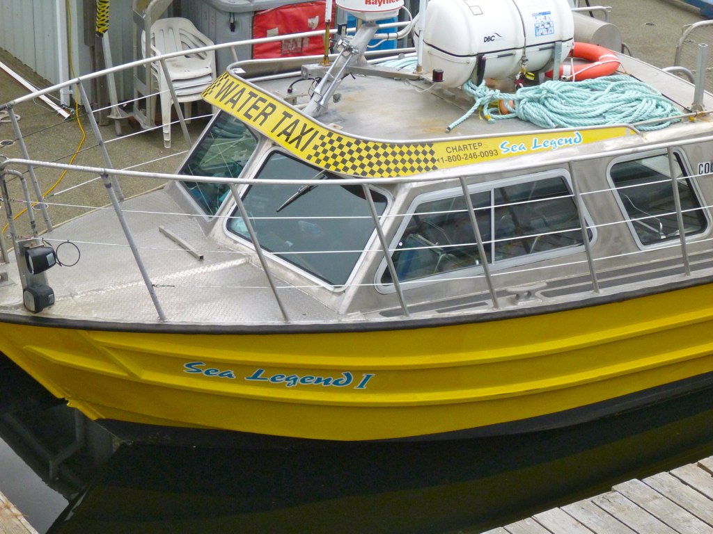 a big yellow boat tied up to the dock