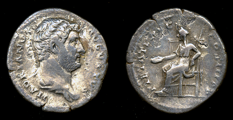 the oblong left and large right sides of a roman coin, probably an angel