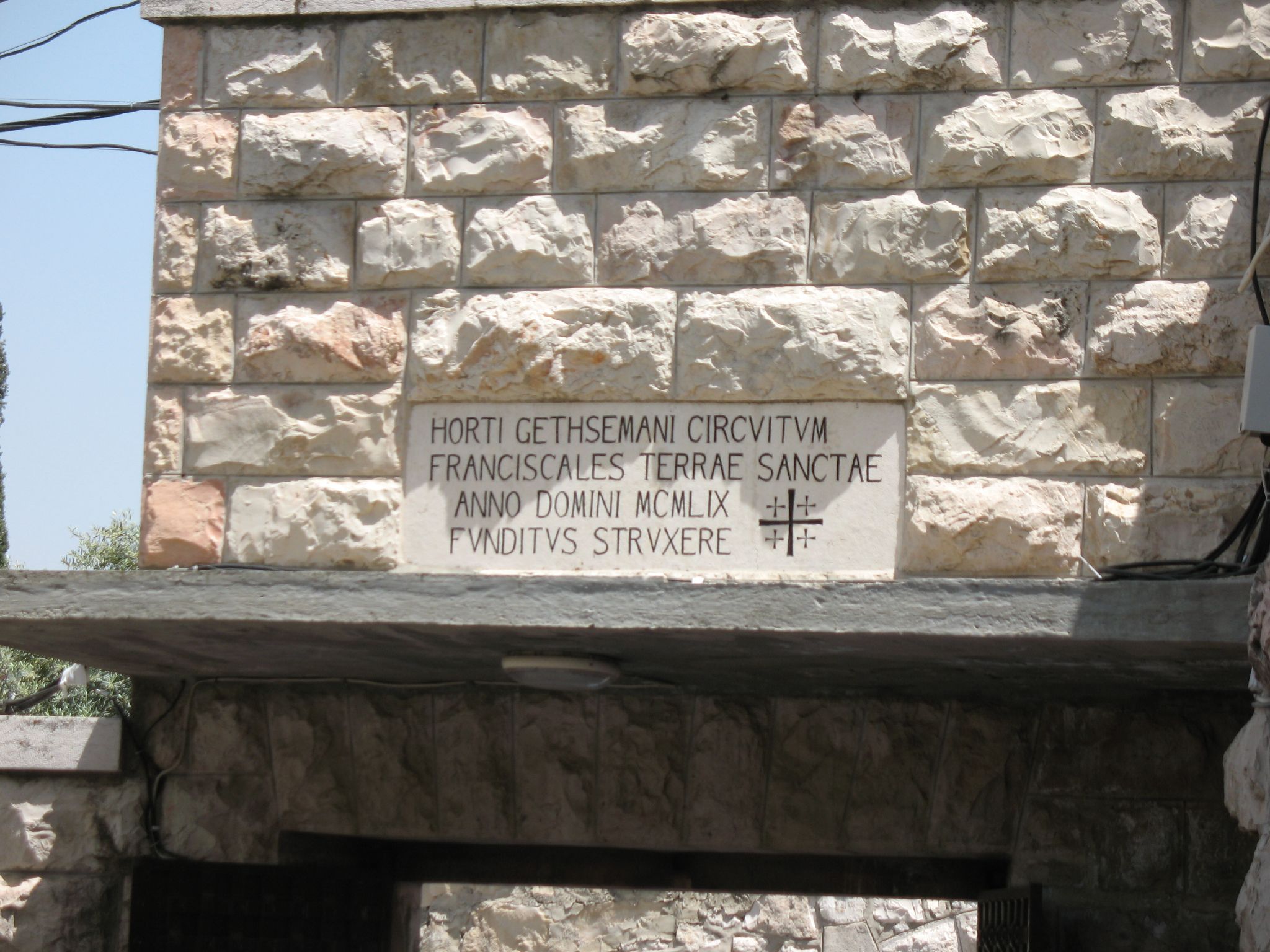 stone brick wall and the inscription on it