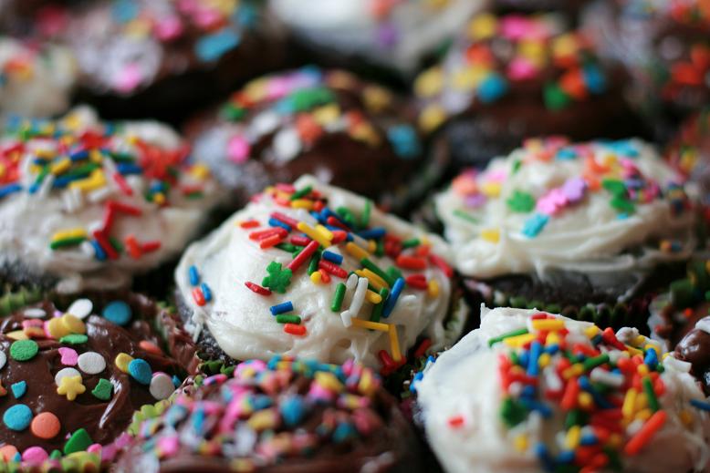 many different kinds of cupcakes with sprinkles