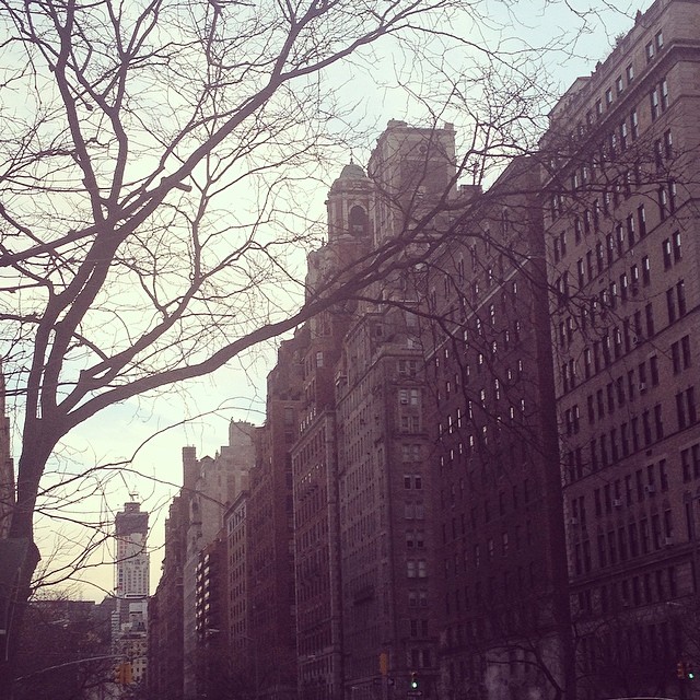 an old looking city street near many skyscrs