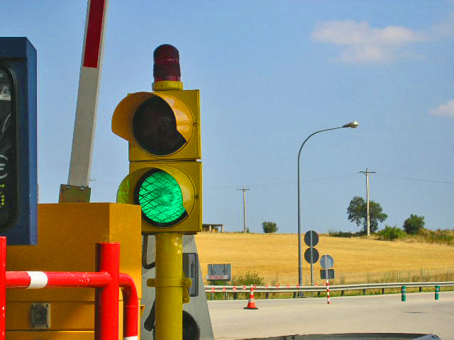 a traffic light that is next to some poles